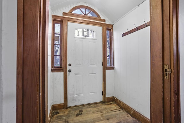 entrance foyer with wood-type flooring and lofted ceiling