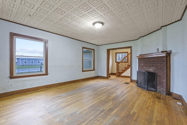 living room with a fireplace and hardwood / wood-style floors