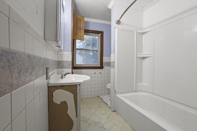 full bathroom featuring tile patterned floors, ornamental molding, vanity, shower / washtub combination, and tile walls