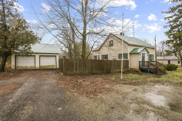 view of side of property featuring a garage