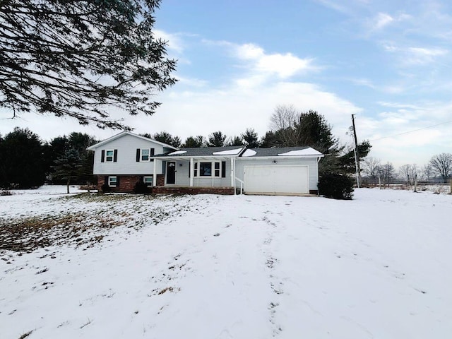 view of front of home with brick siding and a garage