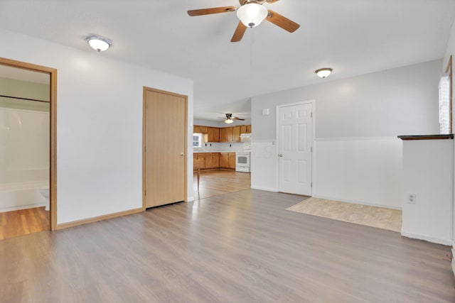 unfurnished living room with light hardwood / wood-style flooring and a healthy amount of sunlight