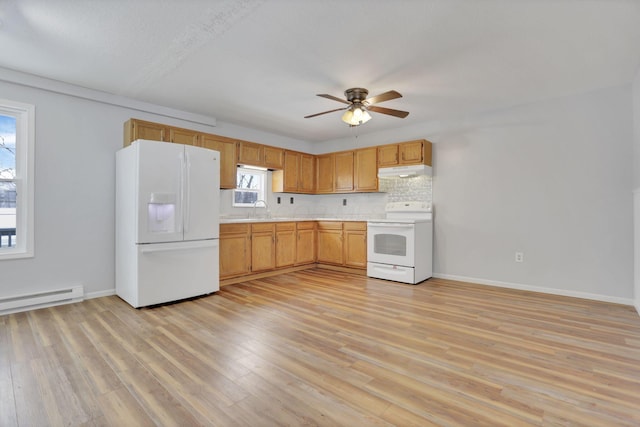 kitchen with white appliances, light hardwood / wood-style flooring, baseboard heating, and sink