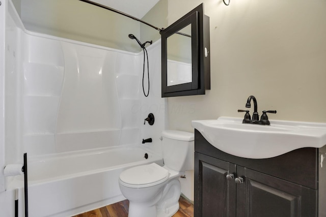 full bathroom with hardwood / wood-style floors, vanity, toilet, and shower / bathing tub combination