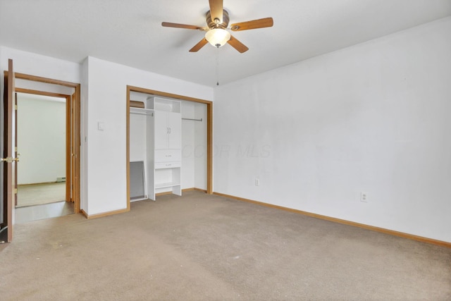 unfurnished bedroom featuring ceiling fan and light carpet