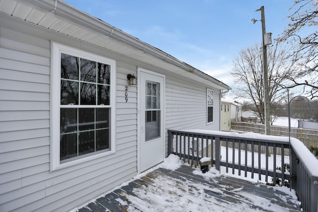 view of snow covered deck