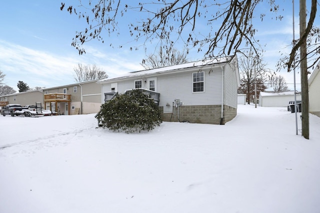 view of snow covered house