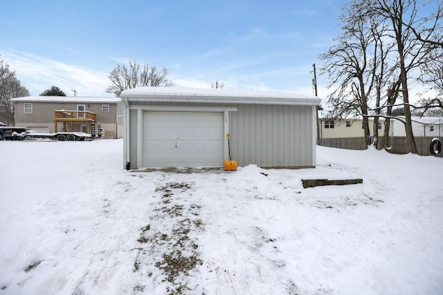 view of snow covered garage