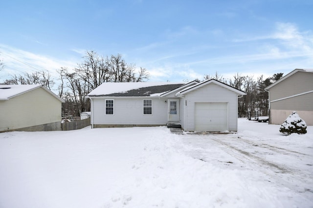 view of snow covered back of property