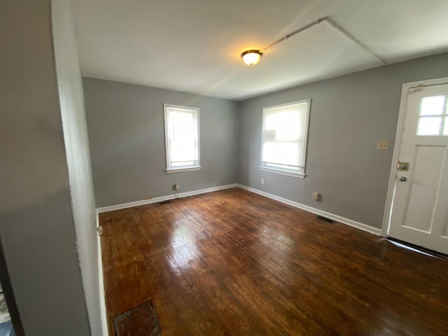 foyer entrance with dark hardwood / wood-style flooring