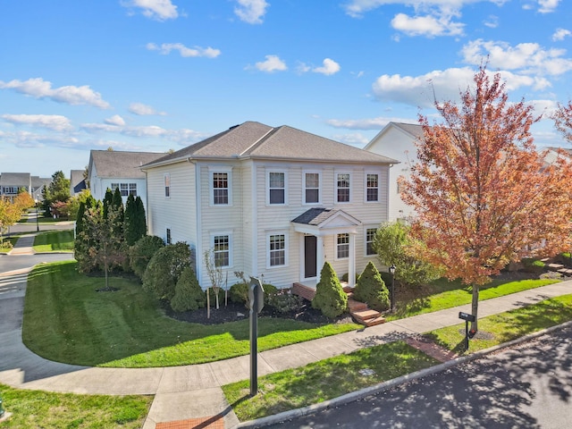 view of front of home featuring a front yard