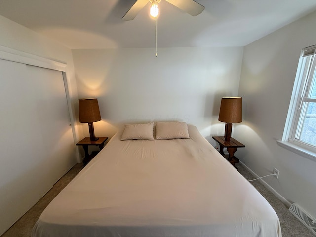 bedroom featuring ceiling fan, carpet floors, and a closet