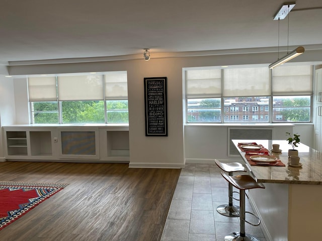 unfurnished living room featuring dark hardwood / wood-style floors