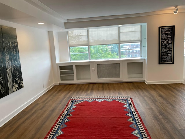 spare room featuring dark hardwood / wood-style floors