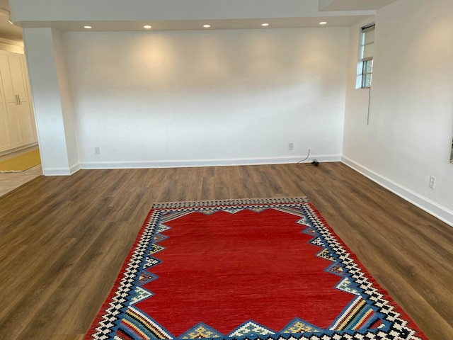 unfurnished room featuring dark hardwood / wood-style flooring