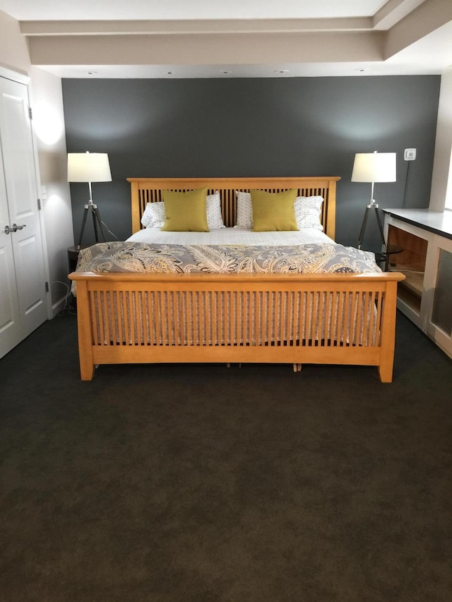 bedroom with dark carpet