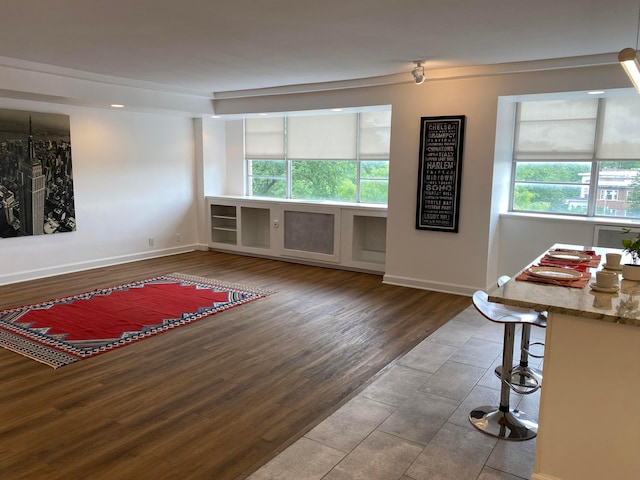 living room with plenty of natural light and hardwood / wood-style floors