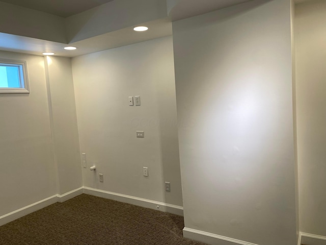 washroom featuring dark colored carpet