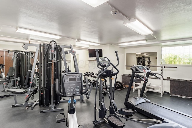 workout area featuring a textured ceiling