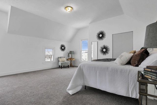 bedroom with carpet flooring and vaulted ceiling