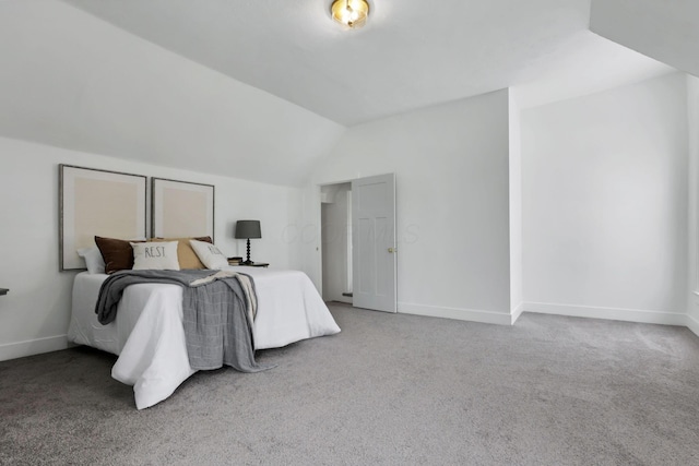 carpeted bedroom featuring lofted ceiling