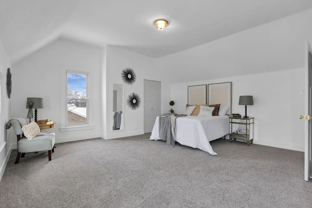 carpeted bedroom featuring lofted ceiling