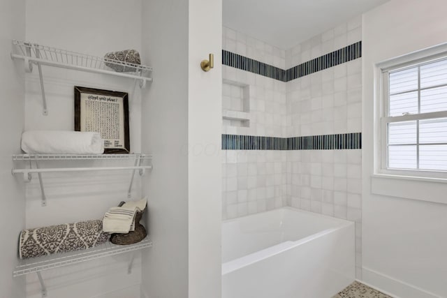 bathroom with a tub to relax in