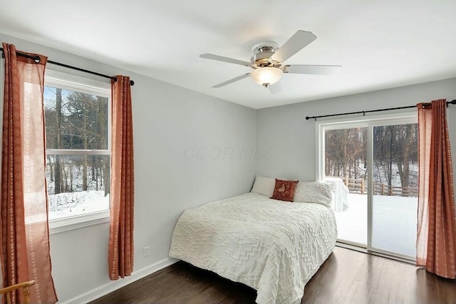 bedroom with dark hardwood / wood-style flooring, access to outside, and ceiling fan