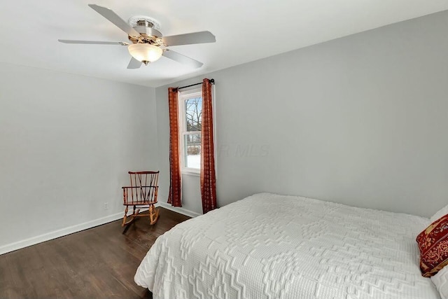 bedroom featuring dark wood-type flooring and ceiling fan