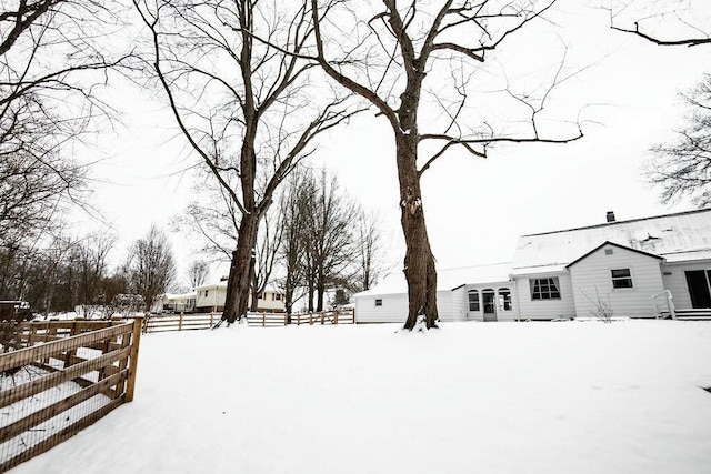 view of yard covered in snow