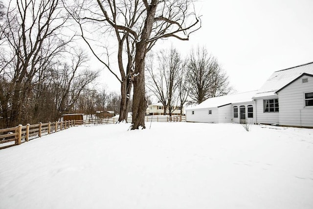 view of yard covered in snow