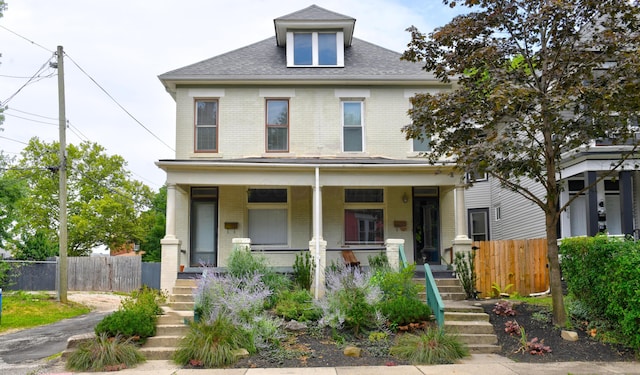 view of front of property featuring covered porch