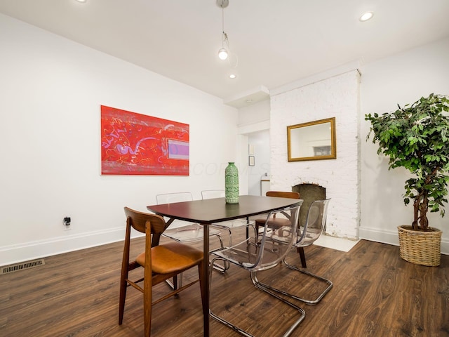 dining space with dark wood-type flooring