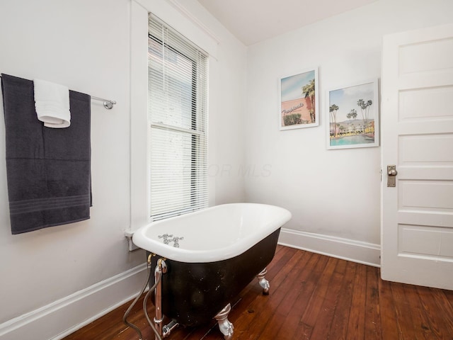 bathroom featuring a bathtub and hardwood / wood-style flooring