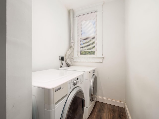 washroom with washer and clothes dryer and dark wood-type flooring