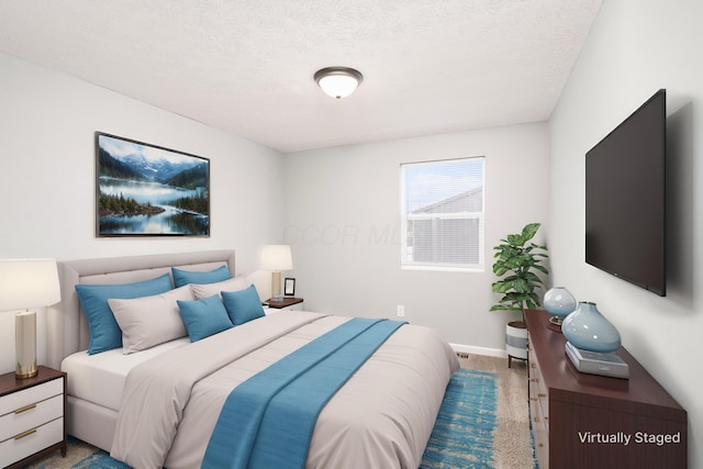 carpeted bedroom with a textured ceiling