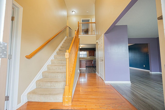 stairway with wood-type flooring