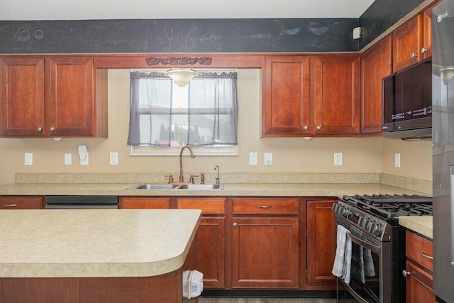 kitchen with dishwashing machine, stainless steel gas range oven, and sink