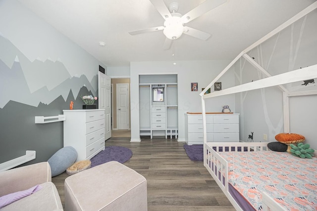 bedroom featuring ceiling fan and dark wood-type flooring