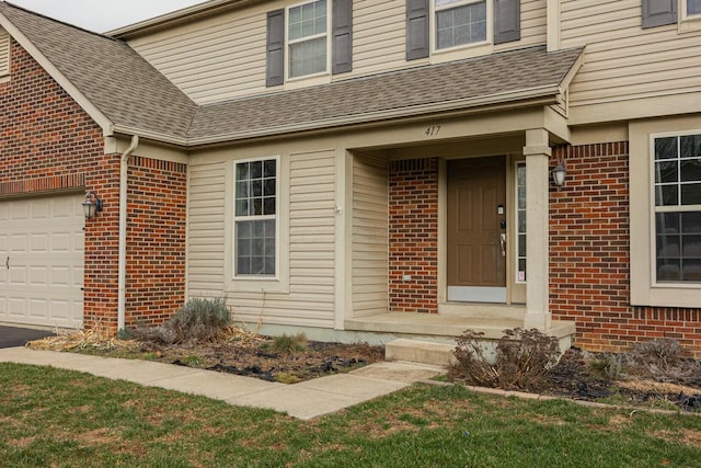 property entrance with a garage