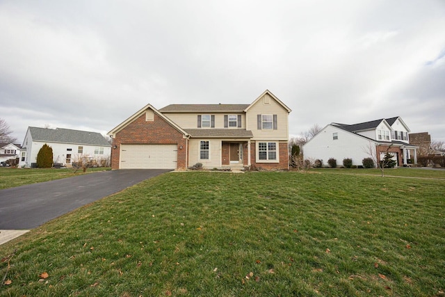 front facade with a front yard and a garage