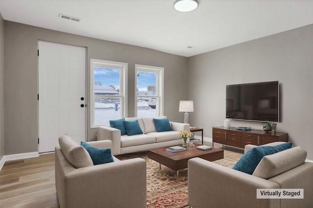 living room with light hardwood / wood-style floors