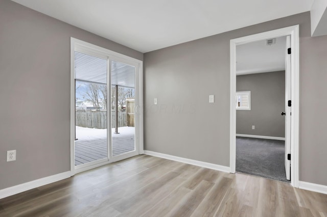 empty room featuring light hardwood / wood-style floors