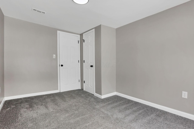 unfurnished room featuring carpet flooring