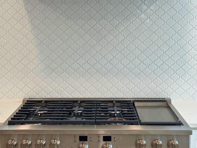 3519 Redding Rd, Columbus, OH 43221 - kitchen view of stainless steel range with gas cooktop, light countertops, and decorative backsplash