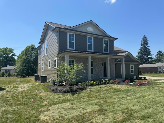 3519 Redding Rd, Columbus, OH 43221 - view of front of house featuring covered porch, a front lawn, brick siding, and a shingled roof