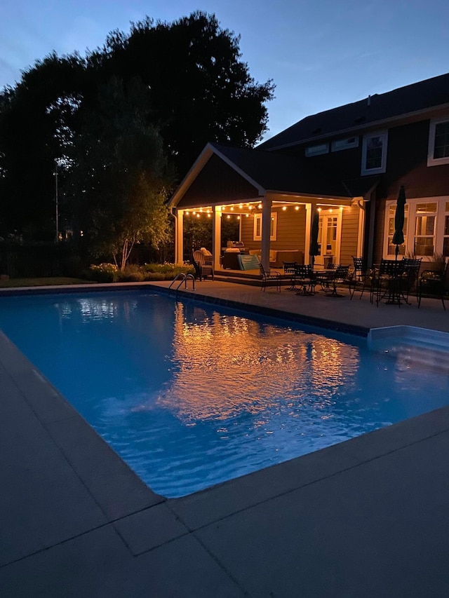 outdoor pool featuring a patio area and outdoor lounge area