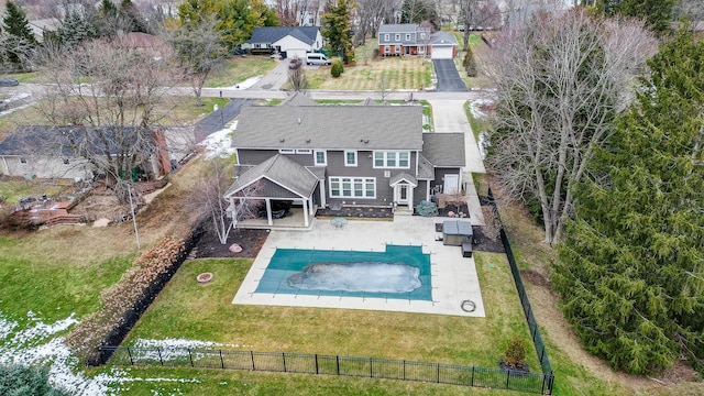 view of swimming pool featuring a patio area, a yard, and a fenced backyard