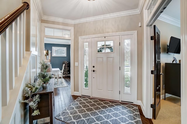 entryway with dark wood-style floors, ornamental molding, stairs, and baseboards