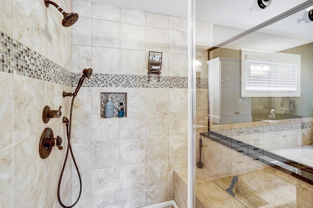 full bath featuring tiled shower